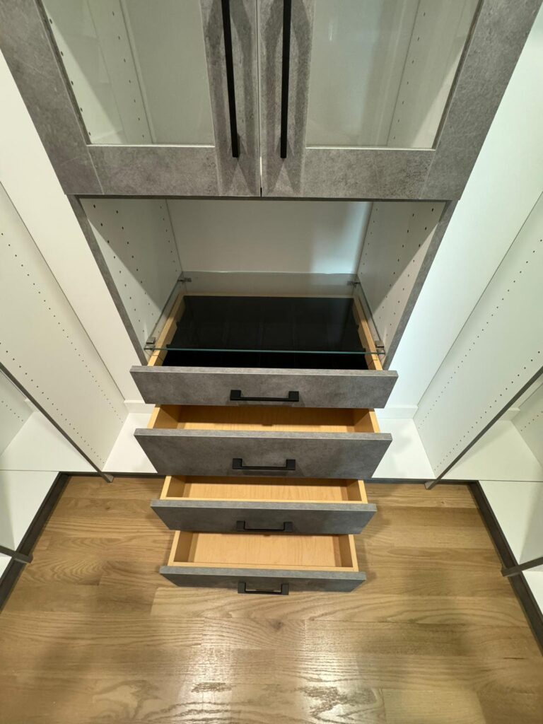 Luxury closet detail featuring premium pull-out drawers with soft-close mechanisms and elegant finishes