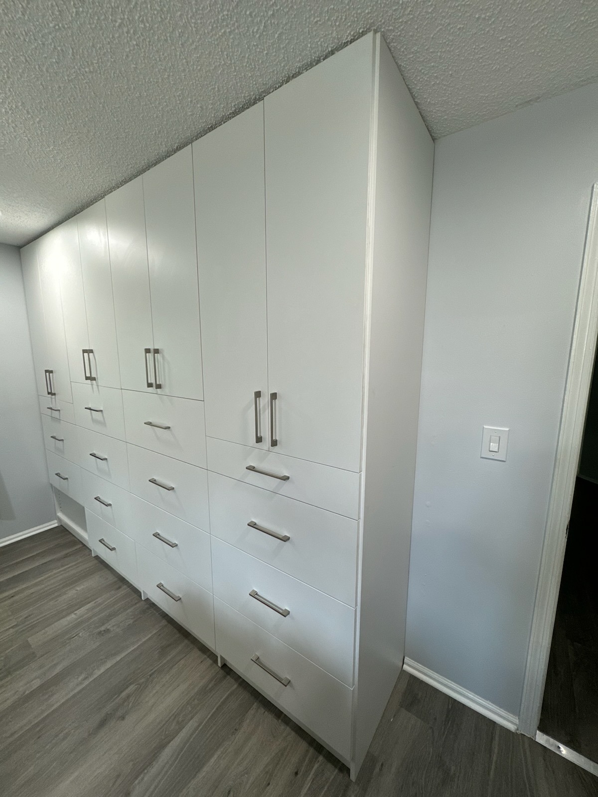 Storage system detail showing white organizational components and quality construction