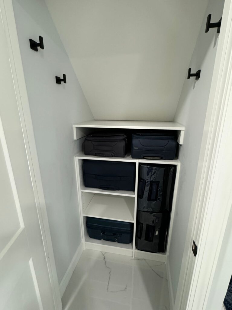 Under stair storage solution with luggage organization and efficient space utilization